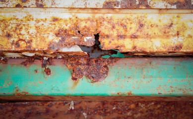 Rust on iron bar with green and white color.Corrosive grunge rusted on old iron.Pattern grunged...
