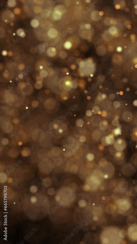 Wall mural blurred golden particles loop movement on vertical background.