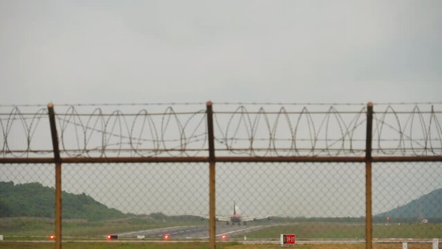 Jumbo jet, wide body double deck aircraft with unrecognizable livery take off, rear view
