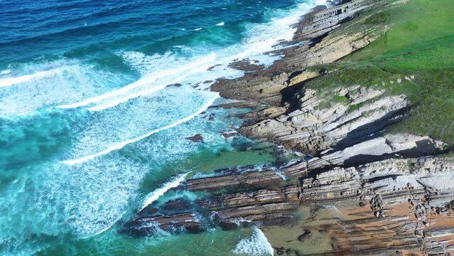 Colors and rock formations of El Sable beach. Coastal landscape in the town of Tagle. Aerial view from a drone. Suances Municipality. Cantabrian Sea. Cantabria. Spain. Europe
