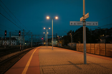 Platform of the train station at night in Katowice, Poland