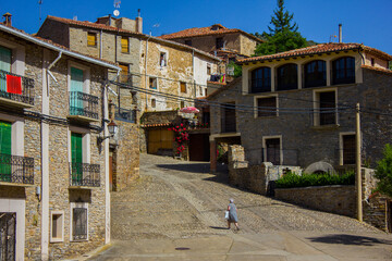 Espa�a vaciada. Empty Spain. Elderly woman walking in beautiful town Yanguas in Soria