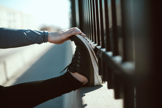 Close up of a man stretching his foot
