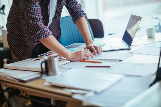 Close up of a male designer sketching in a office - Powered by Adobe