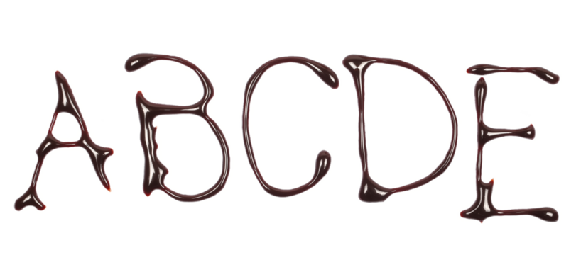 Chocolate topping spreading in shape letter a, b, c, d, e, alphabet isolated on white, top view