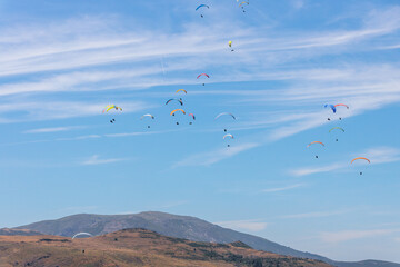 Numerous Paragliders Soaring Over the Serra da Estrela Mountains in Portugal