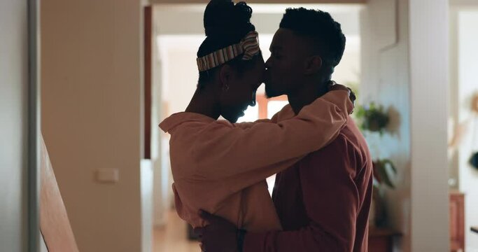 Love, dance and couple with forehead kiss, hug and support at home with trust, security and care. Slow dancing, embrace and black people share intimate moment with music, radio or podcast in house