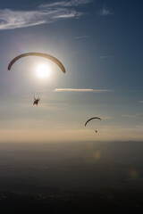 Paragliders Soaring at Sunset