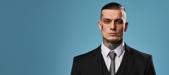 Young caucasian businessman with face and neck tattoos serious face portrait