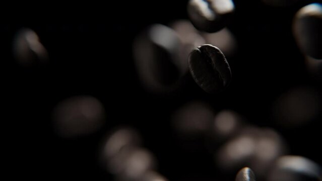 Close up of Coffee beans falling against a black background