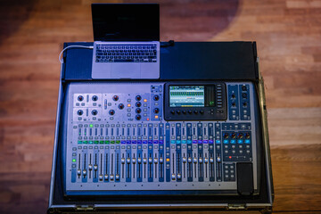 Concert sound mixer panel with volume regulators. Professional audio and light equipment for sound...
