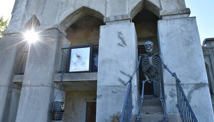 Halloween Decorations on a Stone Mausoleum