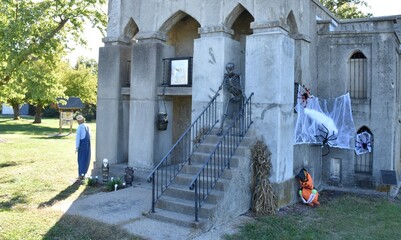 Halloween Decorations on a Stone Mausoleum