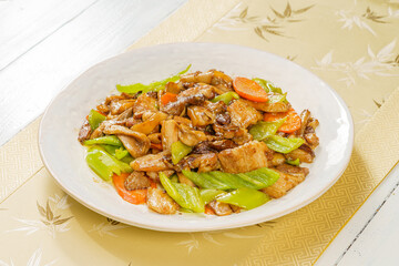 Special Chinese mushroom stir-fried meat on simple background