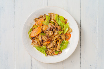 Special Chinese mushroom stir-fried meat on simple background