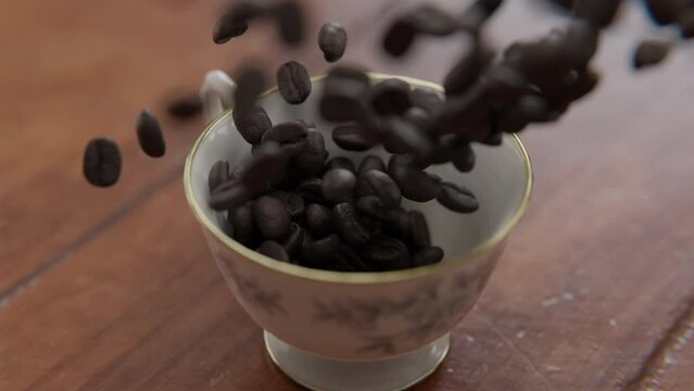 Close up rotating shot of Coffee beans falling into a cup in slow motion