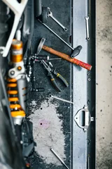Küchenrückwand glas motiv different tools on authentic workbench in workshop for car or bike repair © Bildwerk