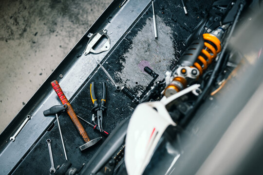 different tools on authentic workbench in workshop for car or bike repair