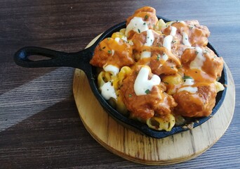 greasy delicious food on an iron plate