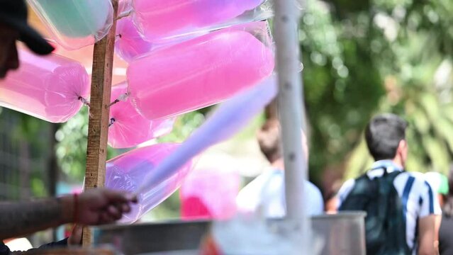 A mexican cotton candy maker store in a parade