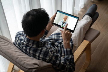 Obraz na płótnie Canvas Doctor video call online by modish telemedicine software application for virtual meeting with patient