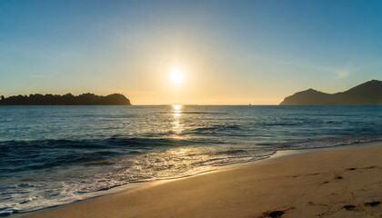 ocean sunrise over the tropical sea shore and exotic island beach