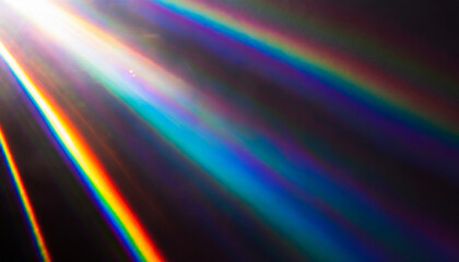 rainbow light effect from sun flares on black background colorful glare and shine light rays on sparkling surface rainbow refraction of sunlight natural light effects iridescent colors