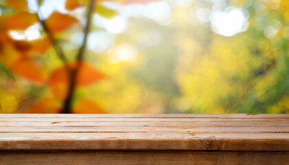 Naklejka na ściany i meble wooden table and blurred bokeh autumn background