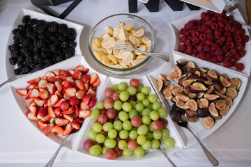 plates with dried fruits and snacks