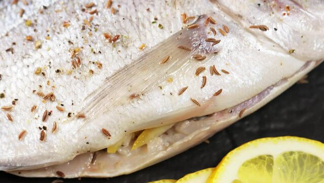 Cooking Fresh Dorado: Mediterranean Seafood Delight. Tilt Up Camera Movement