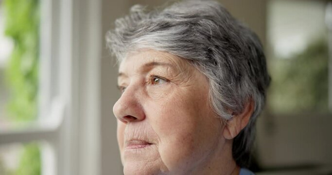 Senior woman, anxiety and thinking on retirement, stress and worry by window for future. Elderly female person, depression and nervous for nursing home, fear and doubt or regret for choice in closeup