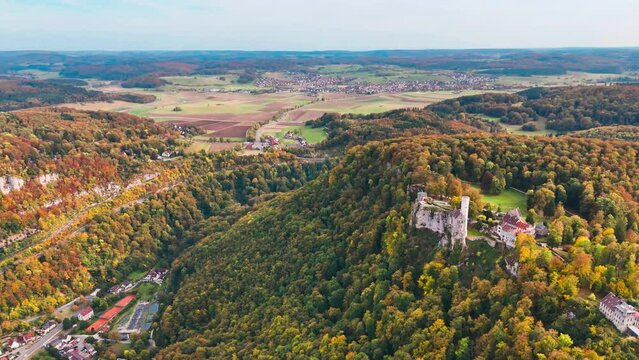 Aerial drone view medieval Lichtenstein castle on mountain, autumn Baden-Wurttemberg, Germany. High quality 4k footage