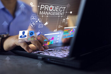 Project management concept. Engineer working on laptop to summary data information management to planning budget and  schedule in available resources for maximum efficiency.