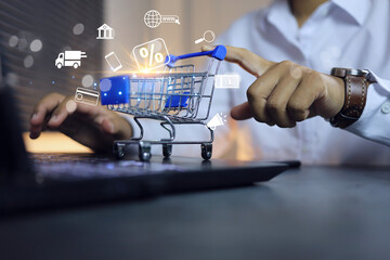 businessman push a shopping cart on laptop represent to visit online store and search add to cart buy and pay on digital banking platform. - obrazy, fototapety, plakaty