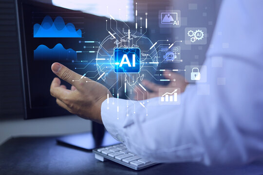 Artificial intelligence concept businessman holding ai on computer screen to using for in document management system and data analysis works