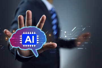 Businessman holding brain of artificial intelligence ai to apply in content creator or creative...