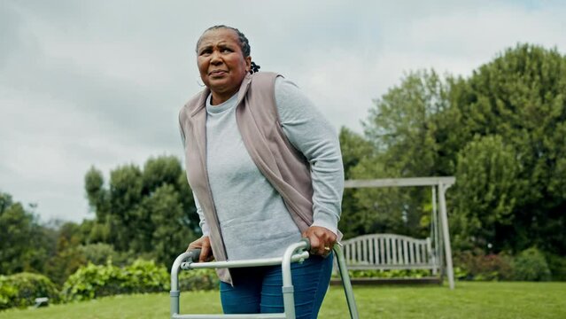 Black woman, senior with walker and retirement, outdoor in garden with fresh air and relax in nature. Environment, person with disability and rehabilitation, elderly care and view in countryside