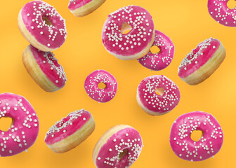 Fototapeta na wymiar Tasty donuts decorated with sprinkles falling on orange background