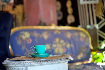 The Cup of cappuccino on a wooden table in a cafe. Beautiful foam, white ceramic cup, copy space.