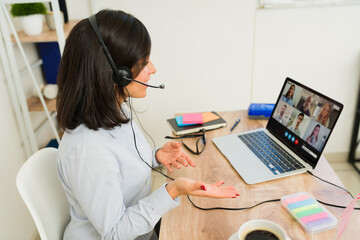 Rear view of an English teacher giving an online lesson