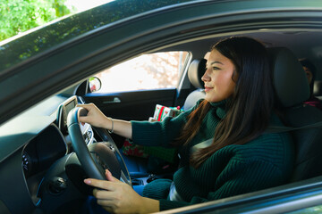 Fototapeta na wymiar Attractive woman enjoying driving her car