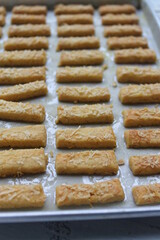 Rows of Indonesian cakes called kastangel on a table ready to serve