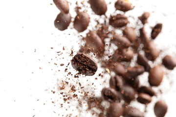 Coffee bean powder fly explosion, Coffee crushed ground float pouring, wave like smoke smell. Coffee bean powder splash throwing in mid Air. White background Isolated selective focus blur