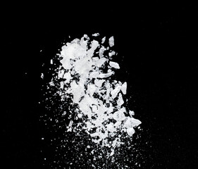 Ice Cubes explosion flying, crystal clear ice wave floating, fall down in air. Ice Brick crack cube is frozen water healthy thirsty. Black background Isolated high speed shutter, freeze stop motion