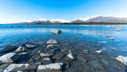 Lake Tekapo in the mountains covered with snow