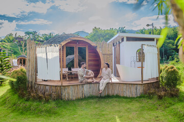 a couple of men and women camping in the mountains of Northern Thailand during vacation. Outdoor...