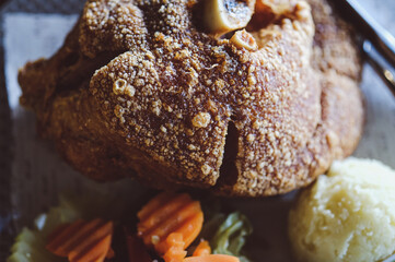 Crispy deep-fried pork knuckle. Close up