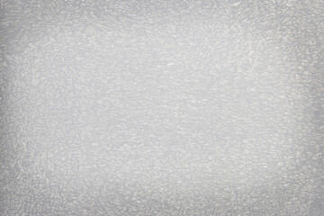 Abstract Gray roller marks on a patterned wall
