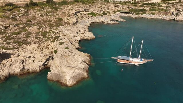 Large old sail boat anchored at Nikolas Beach Kallithea, Rhodes island Greece