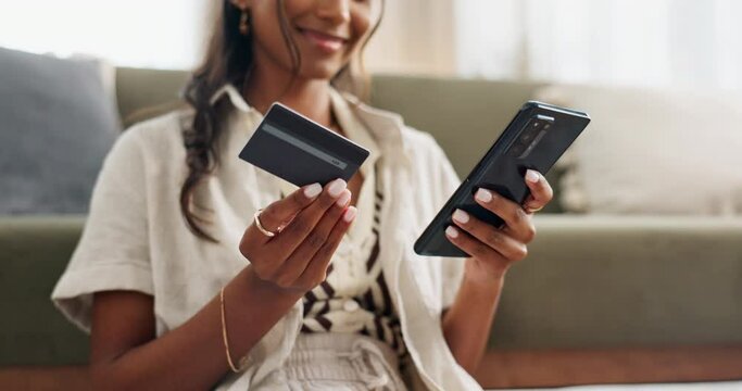 Woman, hands and phone with credit card for payment, online shopping or transaction in living room at home. Closeup of female person on mobile smartphone with debit for purchase, buying or ecommerce